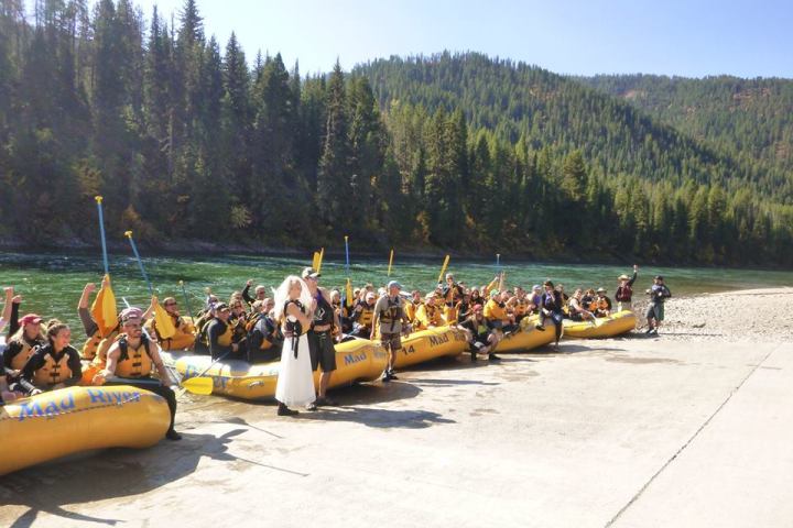 a group of people riding on the back of a boat