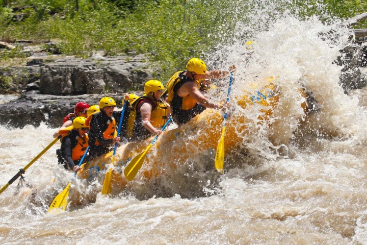 a man in a raft on the water