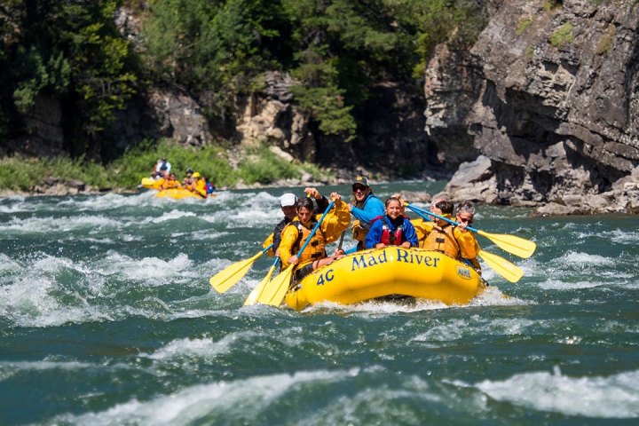 a group of people on a raft in the water