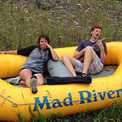a group of people riding on the back of a boat